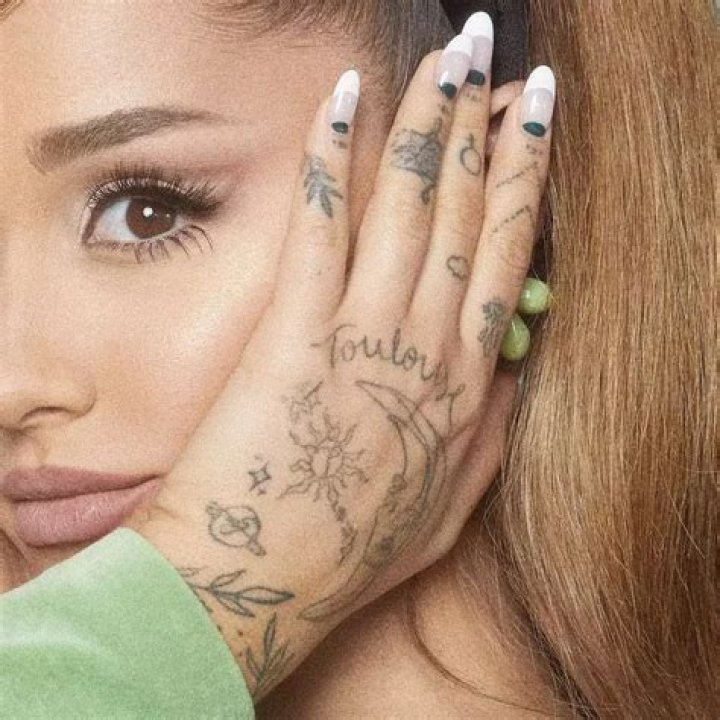 Ariana Grande’s finger tattoos look like they were done with a