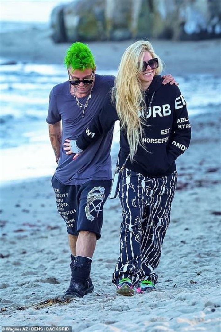 Avril Lavigne and boyfriend Mod Sun pack on PDA on his birthday
