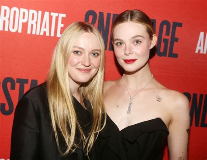 Dakota Fanning keeps a firm grip on her new man as she pulls him out of