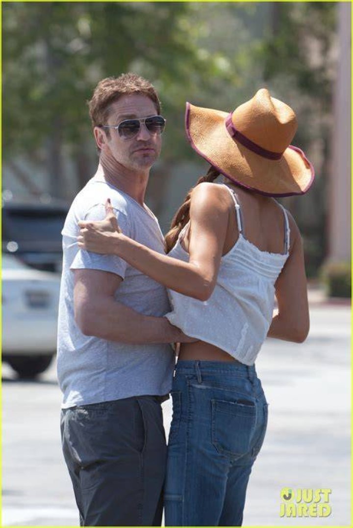 Gerard Butler packs on the PDA with girlfriend Brown at the NYC