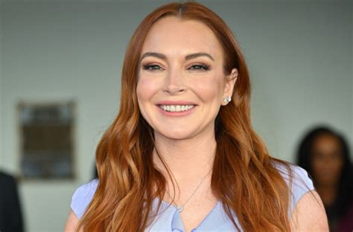 Lindsay Lohan Is Absolutely Glowing as She Cradles Her Baby Bump in New