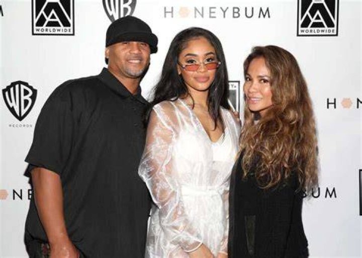 (LR) Saweetie and Dad Johnny Harper arrives at the BET Awards 2021