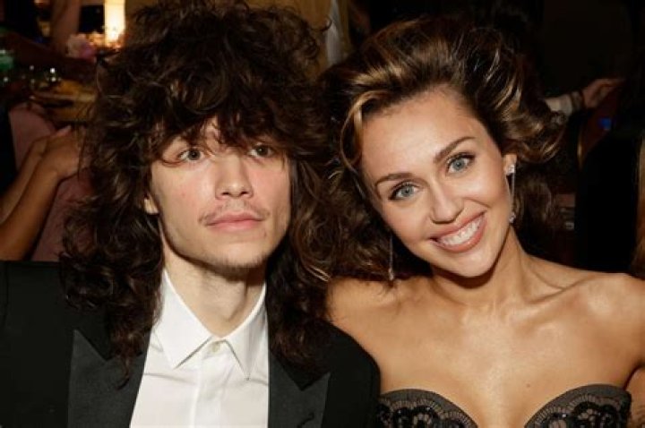 Miley Cyrus and Boyfriend Maxx Morando Appear at Versace Fashion Show